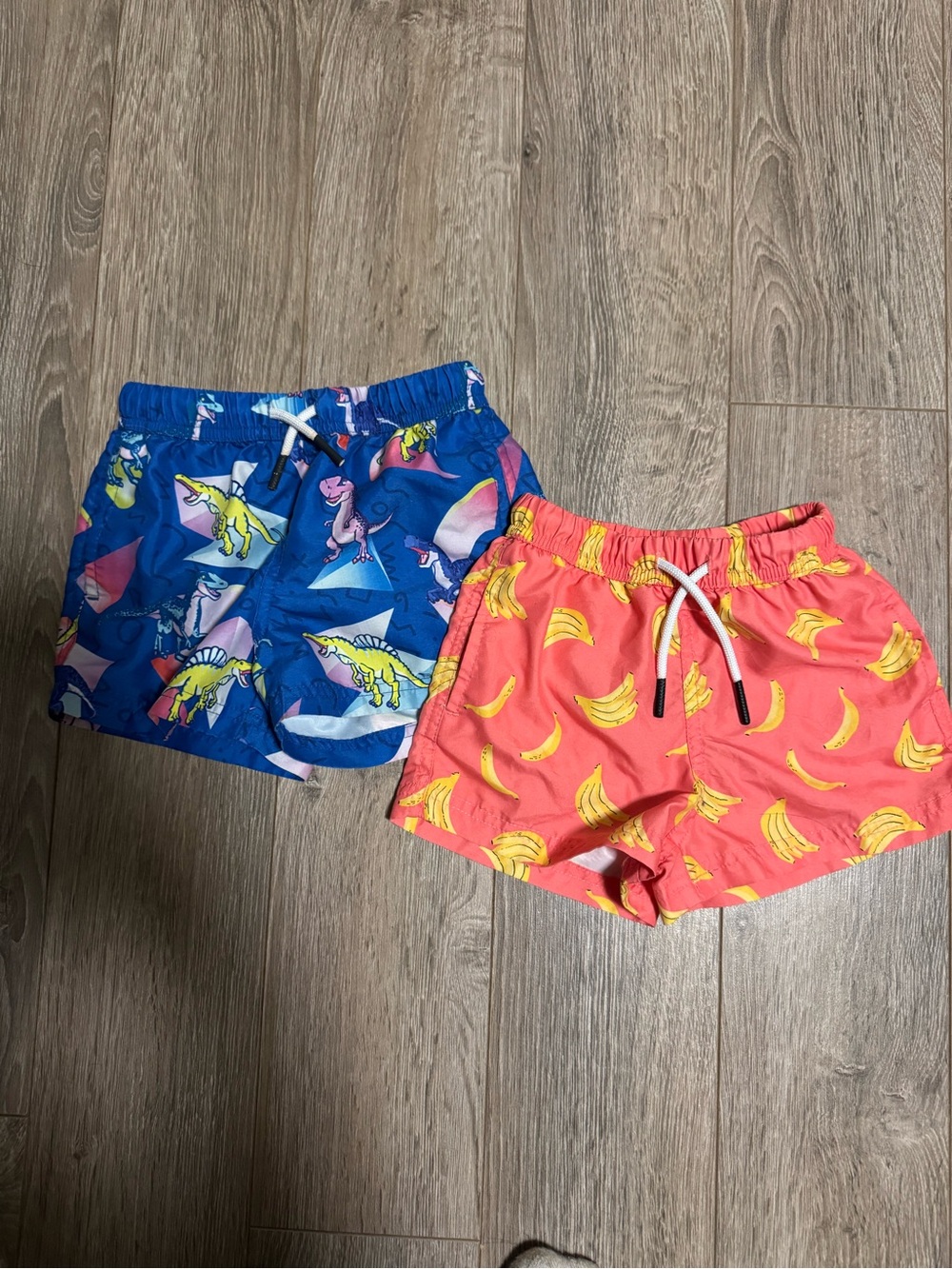 Kids Coral Banana Print Swim Shorts and Dark Blue Dino Swim Shorts